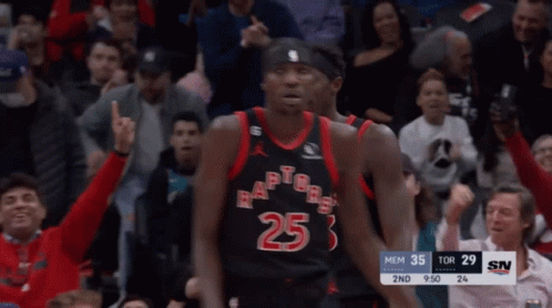 A Group Of Basketball Players Wearing Toronto Raptors Uniforms Shake Hands GIF