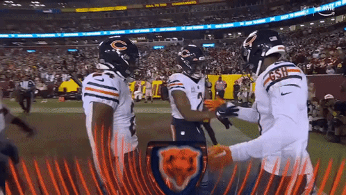 A Group Of Bears Players Are Standing On A Field GIF