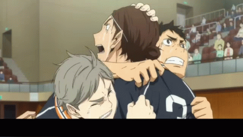 A Group Of Boys Are Hugging Each Other And One Of Them Has The Number 7 On His Shirt GIF