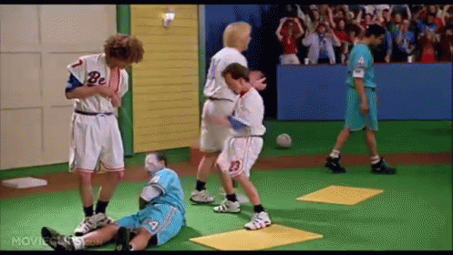 A Group Of Boys Are Playing A Game Of Soccer On A Green Field . GIF