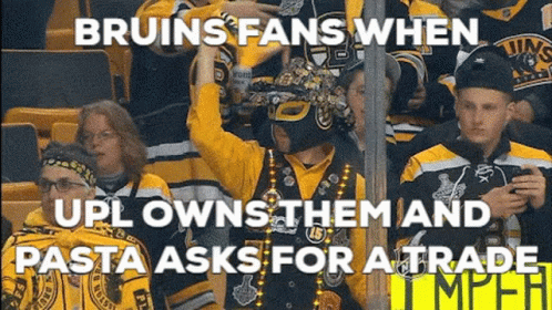 A Group Of Bruins Fans Are Sitting In A Stadium Watching A Hockey Game GIF