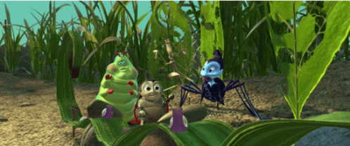 A Group Of Bugs Are Sitting On A Leaf In The Dirt GIF