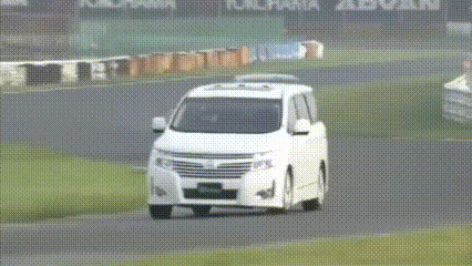 A Group Of Cars Are Driving On A Track With Yokohama Advan Written On The Wall GIF