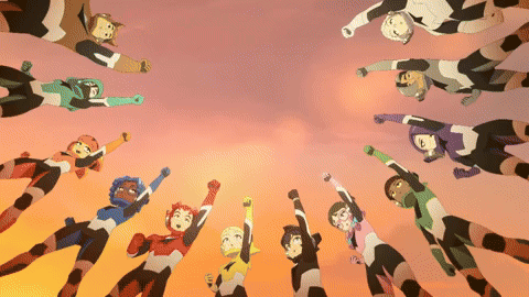 a group of cartoon characters are flying in the air and one of them has the letter t on his chest