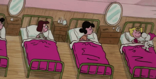 A Group Of Cartoon Characters Are Laying In Beds With Pink Blankets GIF