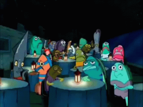 A Group Of Cartoon Characters Are Sitting Around A Table With A Lantern GIF