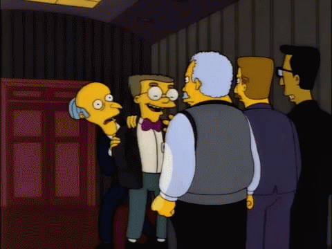 A Group Of Cartoon Characters Are Standing In A Room And One Of Them Is Wearing A Bow Tie GIF