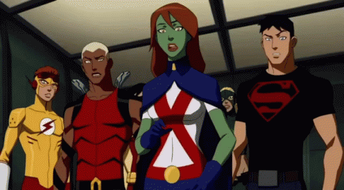 A Group Of Cartoon Characters Are Standing Next To Each Other With One Wearing A Superman Shirt GIF