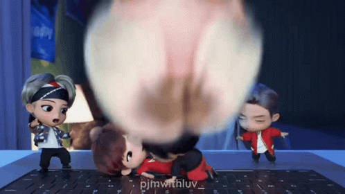 A Group Of Cartoon Characters Are Standing On A Laptop Keyboard . GIF
