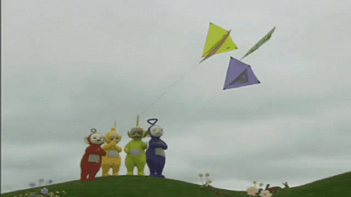 A Group Of Cartoon Characters Flying Kites On A Hill GIF
