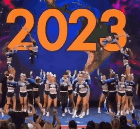 Cheerleaders Jumping In Front Of 2023 Sign GIF