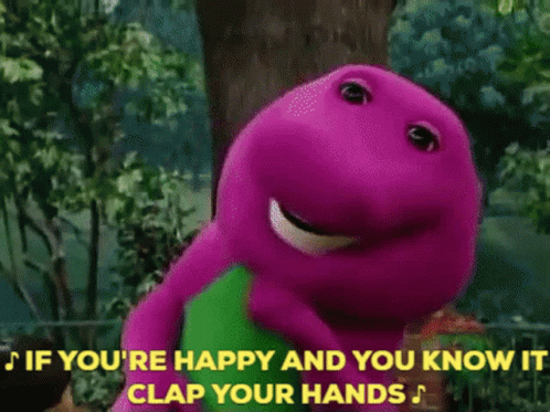 A Group Of Children Are Clapping Their Hands In Front Of A Purple And Green Dinosaur GIF