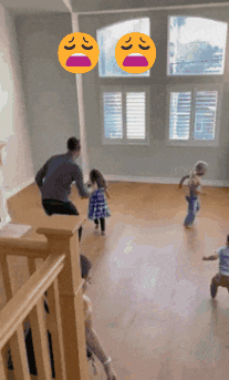 A Group Of Children Are Playing In An Empty Room With A Man Standing In The Middle GIF
