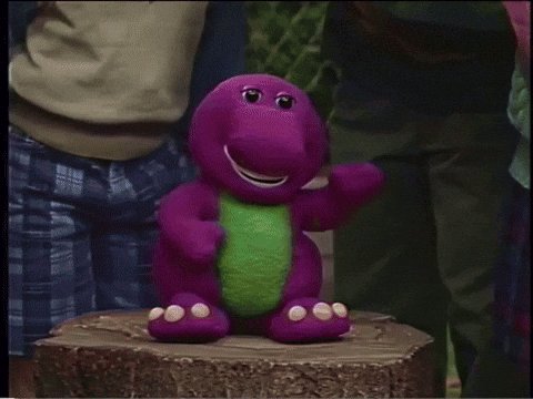 A Group Of Children Are Standing In Front Of A Large Purple Object With A Compass On It GIF