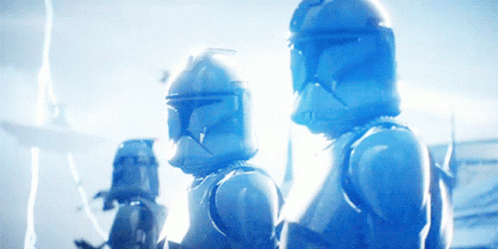 A Group Of Clone Troopers Are Standing Next To Each Other In A Blue Light GIF