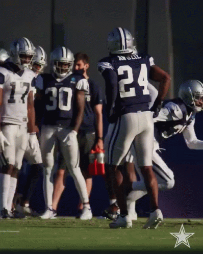 A Group Of Cowboys Football Players Including Number 24 GIF