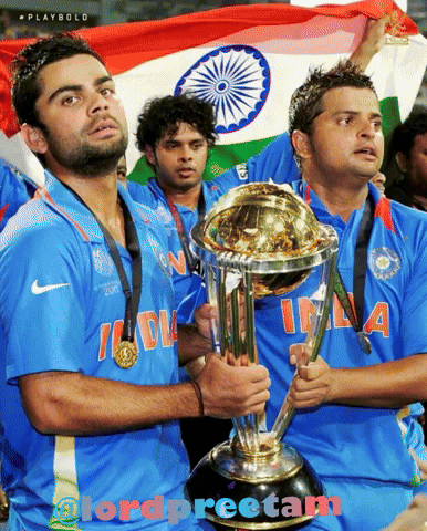 A Group Of Cricket Players Holding A Trophy And A Flag GIF