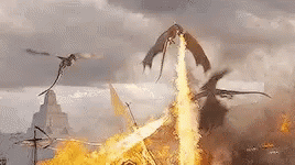 A Group Of Dragons Are Flying Over A Burning Castle . GIF