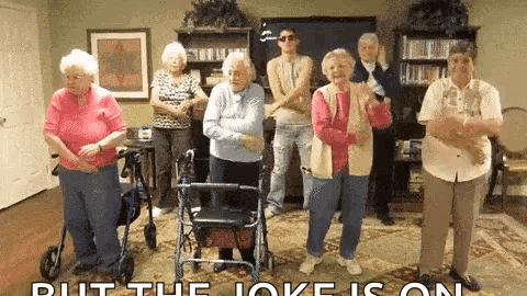 A Group Of Elderly People Are Standing In A Living Room Dancing . GIF
