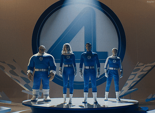 A Group Of Fantastic Four Standing On A Stage In Front Of A Kepler Logo GIF