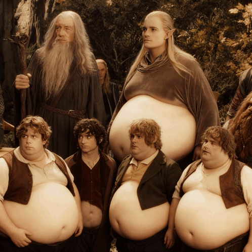 A Group Of Fat Men Standing Next To Each Other With A Wizard In The Background GIF