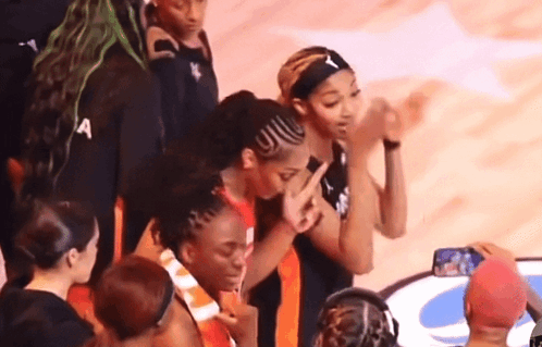 A Group Of Female Basketball Players Including One Wearing A Headband That Says A On It GIF