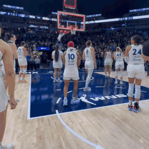 A Group Of Female Basketball Players Standing On A Court With One Wearing The Number 10 GIF