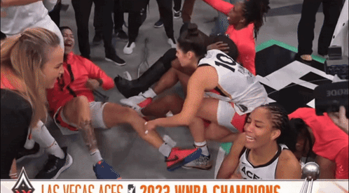A Group Of Female Basketball Players With The Number 10 On Their Backs GIF