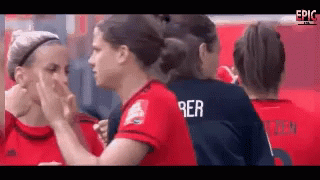 A Group Of Female Soccer Players Are Touching Each Other 'S Faces And One Of Them Has The Name Rer On Her Jersey GIF