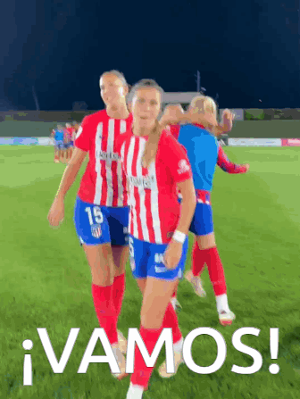 A Group Of Female Soccer Players Are Walking On A Field With The Words Vamos Written On The Bottom GIF