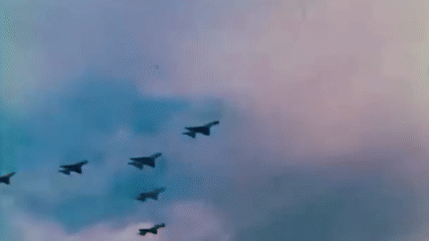 A Group Of Fighter Jets Are Flying In Formation GIF