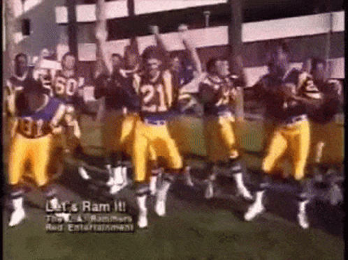 A Group Of Football Players Are Dancing On A Field With The Words Let 'S Ram It On The Bottom GIF