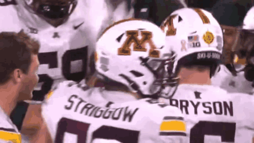 A Group Of Football Players Are Huddled Together And One Of The Players Is Named Strigiow GIF