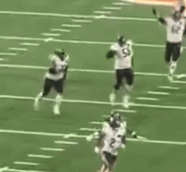 A Group Of Football Players Are On A Field With One Wearing Number 82 GIF