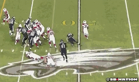A Group Of Football Players Are Playing A Game On A Field And One Of The Players Has The Number 96 On His Jersey GIF