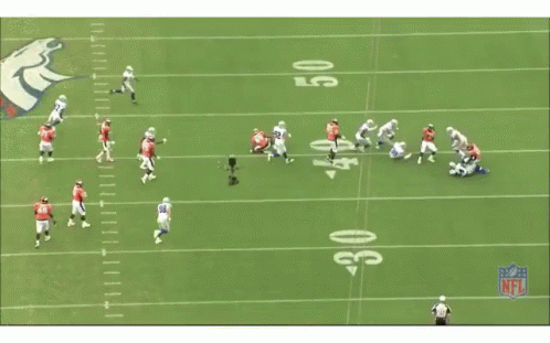 A Group Of Football Players Are Running On A Field With A Nfl Logo In The Background GIF