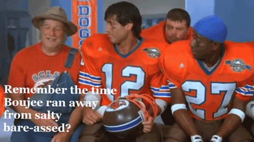 A Group Of Football Players Are Sitting In A Locker Room And One Of Them Has The Number 12 On Their Jersey GIF