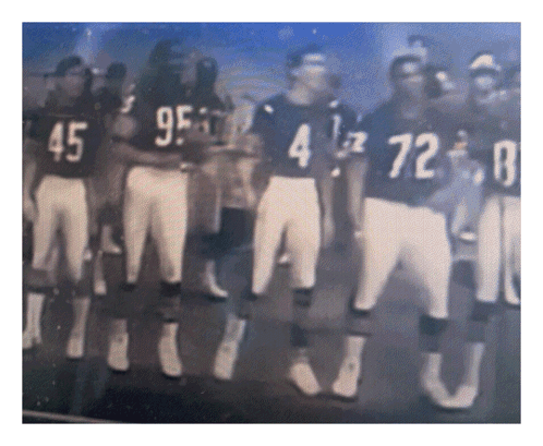 A Group Of Football Players Are Standing In A Line With One Wearing The Number 4 GIF