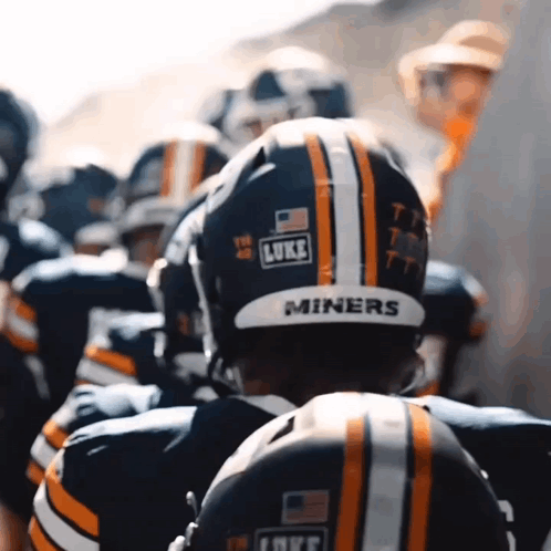 a group of football players are wearing helmets that say miners