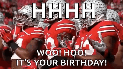 A Group Of Football Players In Red Uniforms Are Standing Next To Each Other On The Field . GIF