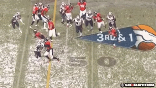 a group of football players on a field with a banner that says 3rl & 1 on it