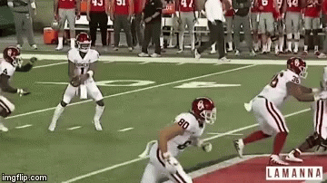 A Group Of Football Players On A Field With The Number 80 On The Back Of Their Jersey GIF