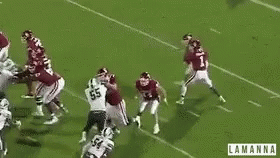 A Group Of Football Players On A Field With The Word Lamanna On The Bottom Right GIF