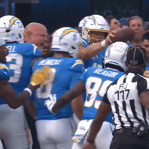 A Group Of Football Players With One Wearing The Number 3 On His Jersey GIF