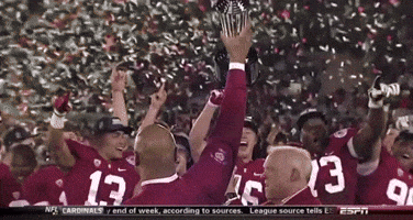 a group of football players with the number 13 on their jerseys are celebrating