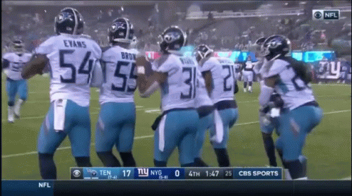 A Group Of Football Players With The Number 54 On The Back GIF
