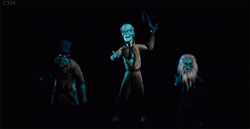 A Group Of Ghosts Are Dancing In The Dark . GIF