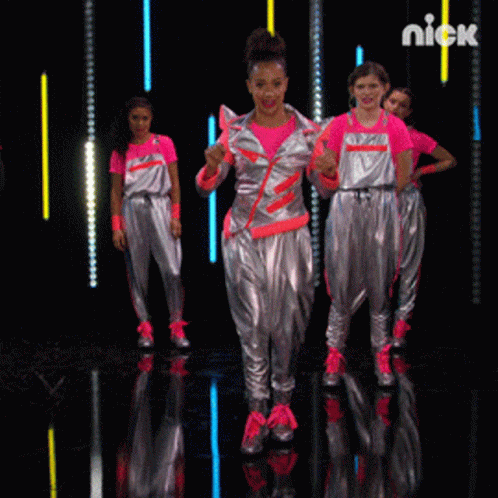 a group of girls are dancing on a stage and the word nick is on the bottom