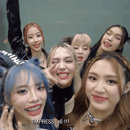 A Group Of Girls Are Posing For A Picture And One Of The Girls Says Empress GIF