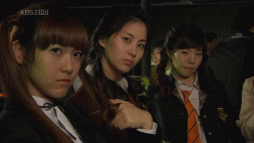 A Group Of Girls Are Standing In Front Of A Kbs2 Hd Screen GIF